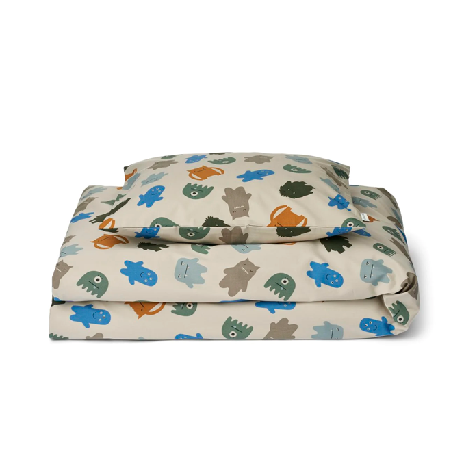 01_Liewood Carmen Baby sengetøj m print, monsters blu mix.png